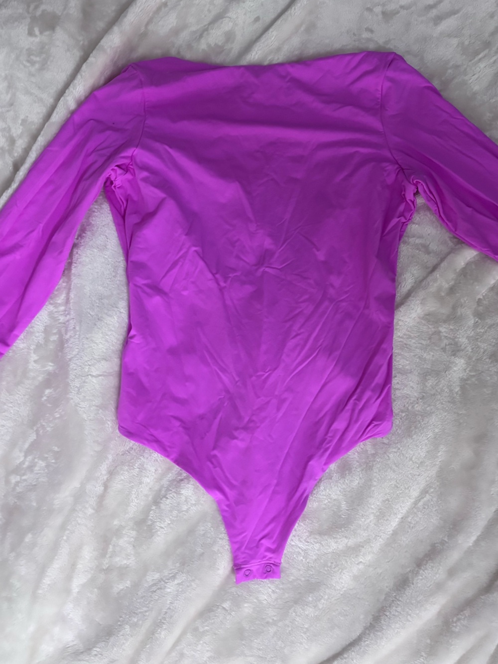 Skims pink body suit with open back